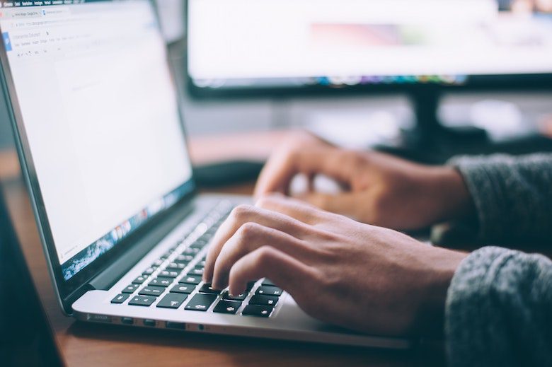 person typing on a computer